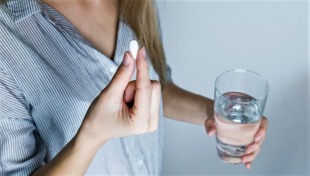 women taking pill