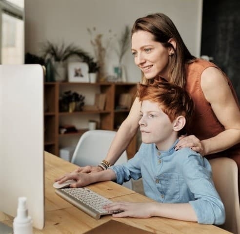 Mom teaching son, (Photo Julia M Cameron, Pexels)