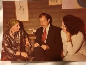 In the living room of the Dorothy Fratt and Bud Cooper home on Camelback Mountain, Louise Nevelson, left, chats with Cooper's niece, JoAnne Hutchison Cooper, left, and an art critic.