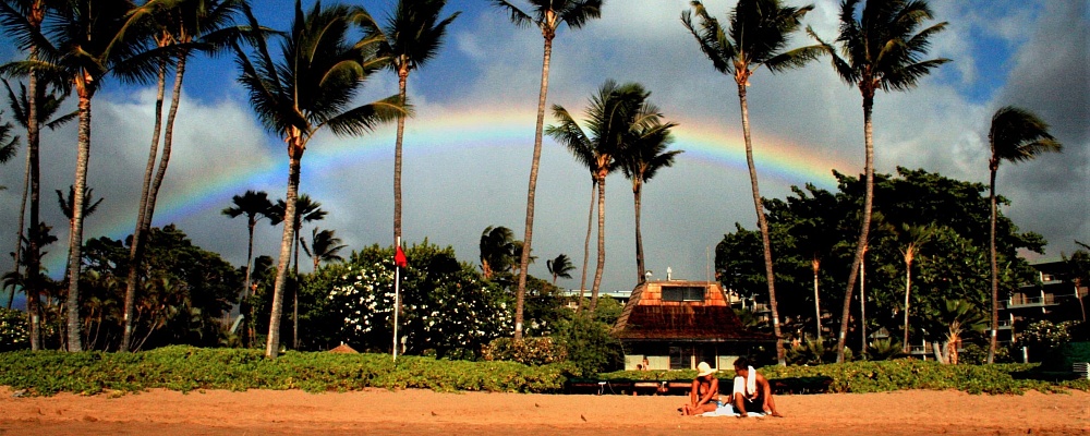 Rainbow above sand in Maui