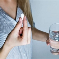 women taking pill