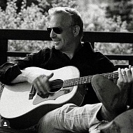 Kevin Costner with guitar