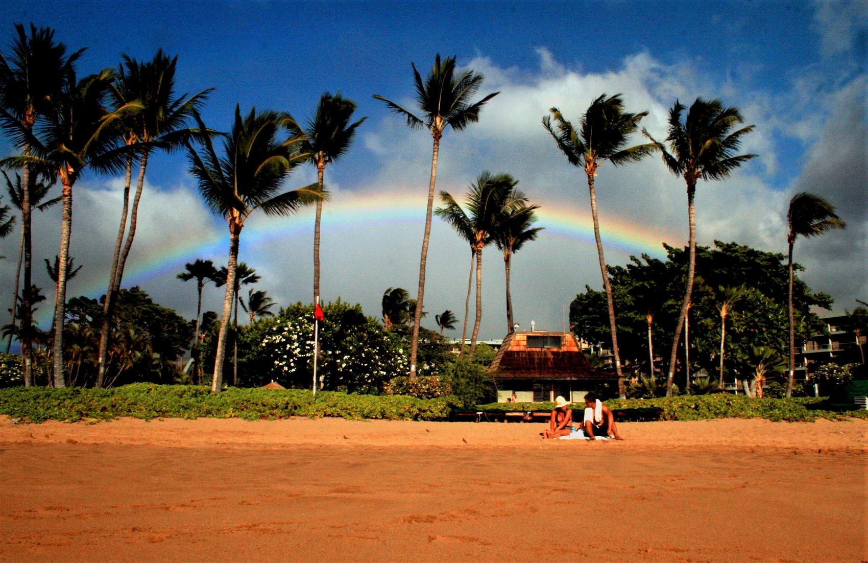 Rainbow above sand in Maui
